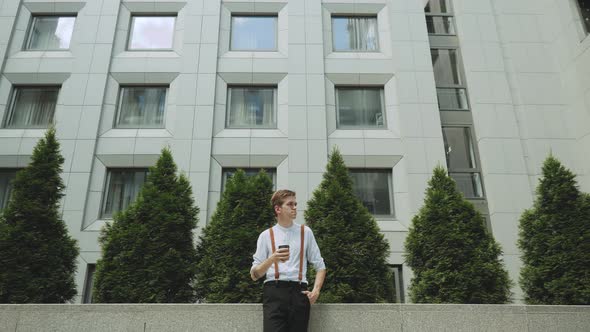 Portrait of Man with a Cup of Coffee Person Dressed in Stylish Clothes Slow Motion