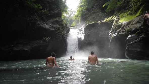 Males and Female Tourist Bathing in the Waterfalls and Enjoying the Fresh Water.