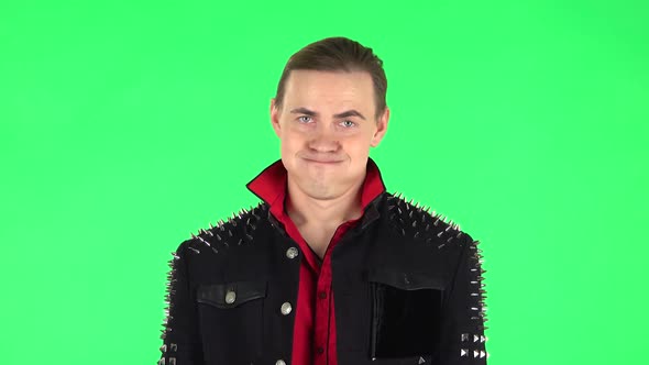 Unhappy Guy Showing Thumbs Down Gesture. Green Screen