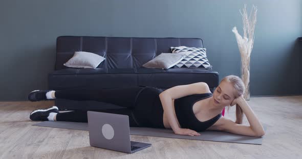 Young Girl Training Online, Watching Fitness Lesson on Laptop