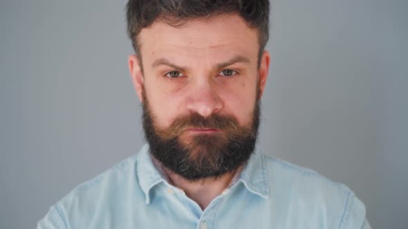 Bearded Man Chewing Chewing Gum. Man Blowing Out a Bubble of Bubble Gum