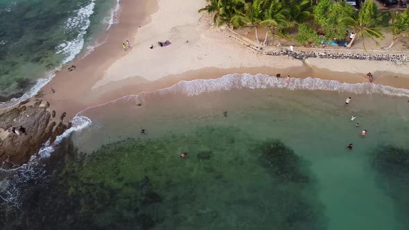 Small Tropical Beach with Rocky Point Aerial