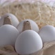Close-up of fresh and selected chicken eggs. White and a golden one. - VideoHive Item for Sale