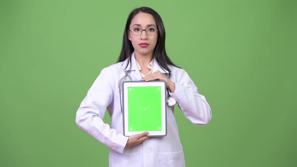 Young Beautiful Asian Woman Doctor Showing Digital Tablet