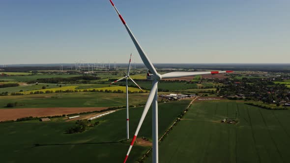 A Drone Shot of a Massive Wind Farm in Agricultural Land