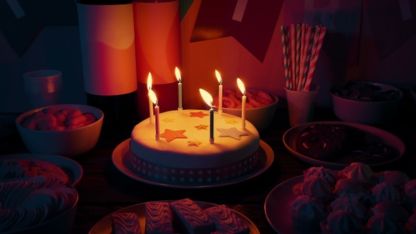 Candles Blown Out On Birthday Cake At Kids Party