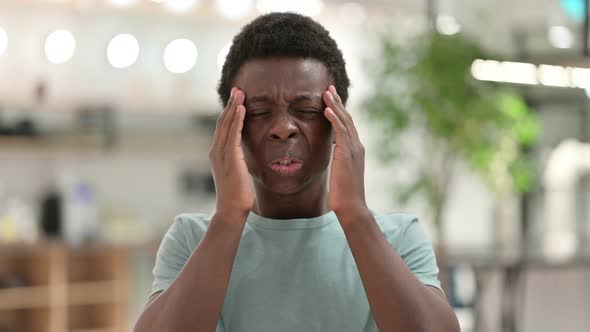 Exhausted Young African Man Having Headache