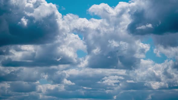 Cumulus Cirrus Clouds Move in the Blue Sky. Time Lapse.