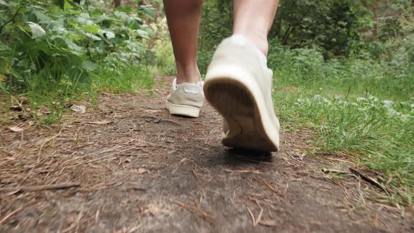 Close Up Hiking Man with Trekking Boots Walking in the Forest