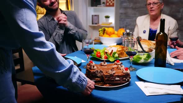 Young Woman Giving Her Husband a Slice of Cake