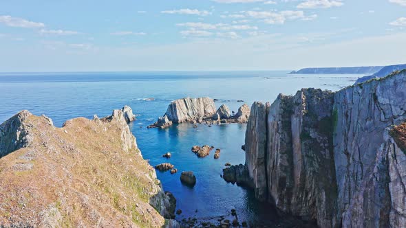 Impressive Rock Formation Cliffs, Playa del Silencio in Asturias. Ascending pullback. Spain