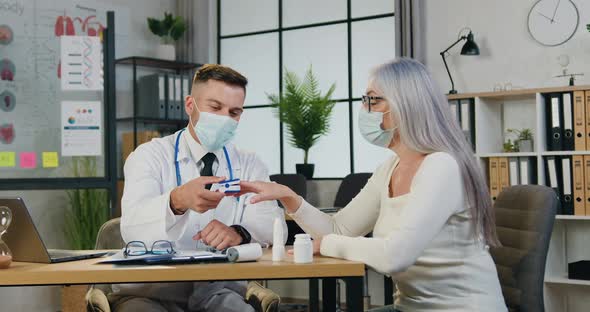 Older Female Patient Oxygen Level in Blood Using Pulse Oximeter During Visit at Clinic in Hospital