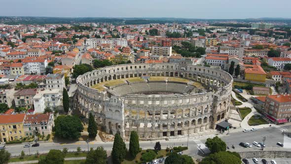 Aerial forwarding shot over Roman Arena in Pula, Istria, Croatia which is a  Unesco World Heritage s