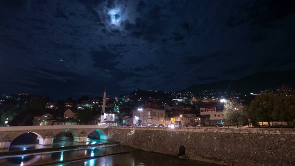 Night timelapse of Sarajevo and moon