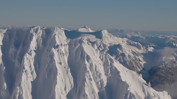 Aerial View of Canadian Mountain Covered in Snow