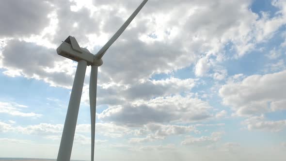 Wind Mill Producing Electricity From Wind in the Background Unless the Sky Is the Bottom View