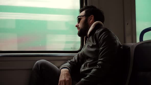 Sad Man Looking On Train Window Worried On Problem. Depressed Man Under Stress Work After Fired Job.