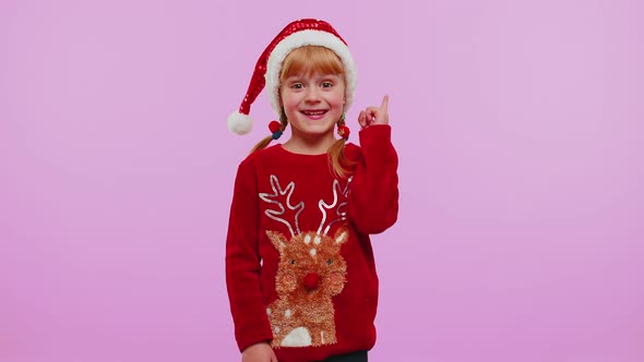 Excited Girl in Christmas Sweater Make Gesture Raises Finger Came Up with Creative Plan Good Idea