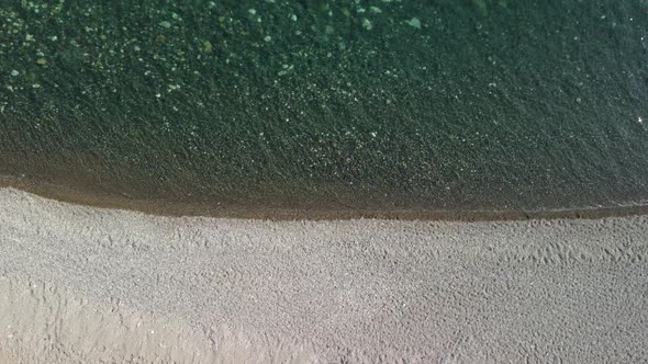 Aerial View on Calm Azure Sea and Volcanic Rocky Shores