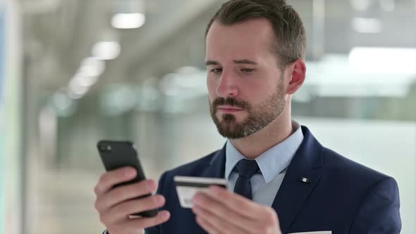 Portrait of Businessman Having Online Payment Failure on Smartphone