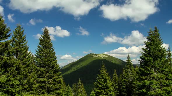 Time Lapse Clouds Move Over Mountain and Forest Rural Landscape