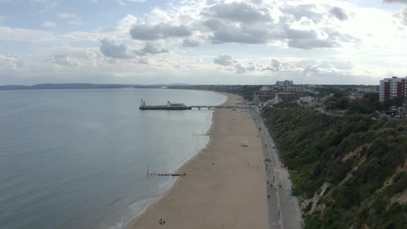 Dolly back drone shot over Bournemouth Promenade