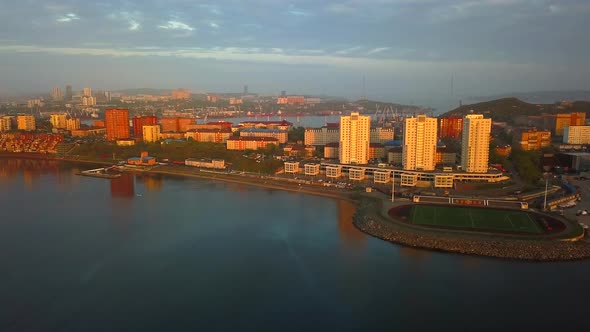 Drone View of the City and Marina Located on the Peninsula at Sunset