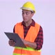 Young Happy Hispanic Man Construction Worker Talking While Reading on Clipboard - VideoHive Item for Sale