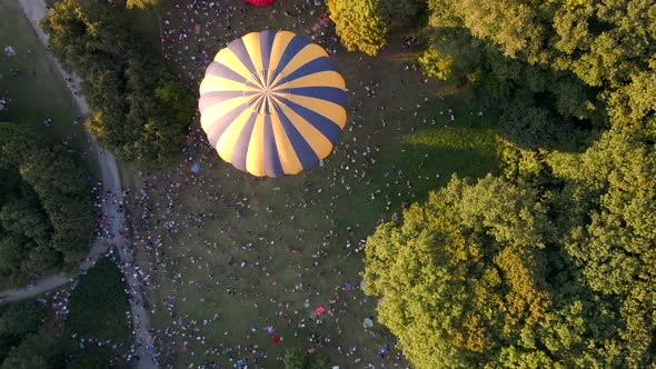 A Lot of People Looking at How Hot Air Balloons Prepare for an Summer Evening Flying in Park in