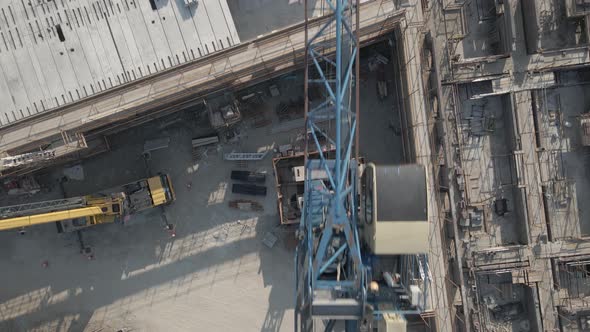 Tower Crane Structure. Drone View Of Counterweights, Mast, Cabin, And Boom Of An Industrial Tower Cr