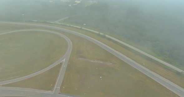 Aerial View Beautiful Early Morning with Low Hanging Fog Looking Over a Meadow Near Highway US 65 in