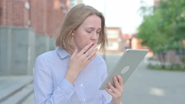 Portrait of Woman Having Loss on Tablet While Walking in Street