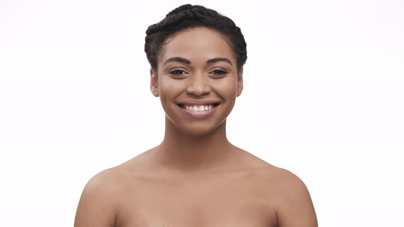 Studio Portrait of Beautiful African American Lady Smiling at Camera White Background