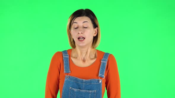 Upset Girl Shrugs and Shakes Her Head Negatively. Green Screen