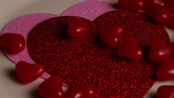 Rotating stock footage shot of Valentines decorations and candies - VALENTINES 0113