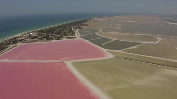 Aerial view of beautiful salt ponds at coast during midday. Las Coloradas, Mexico.