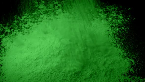 Green Powder Is Poured Into Pile