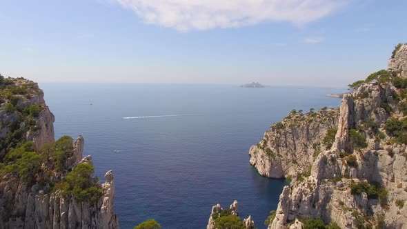 Aerial travel drone view of clear green water, cliffs of Cassis, Mediterranean Sea, Southern France.