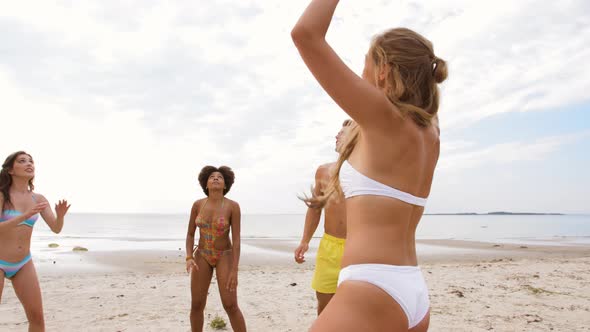 Happy Friends Playing Ball on Summer Beach 6