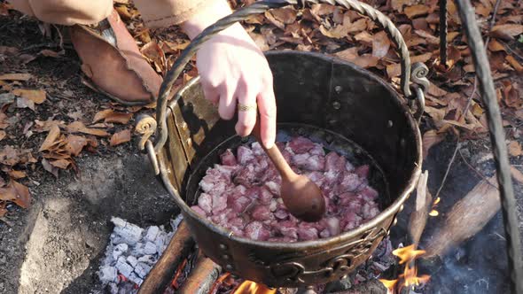 Meat chunks cooking in a pot