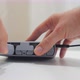 Closeup Men Hand's Installing Battery in the Charging Hub - VideoHive Item for Sale