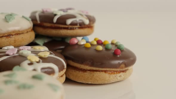 Glazed and stuffed cookies with sprinkles  close-up 4K 2160p 30fps UltraHD tilting footage - Tasty t