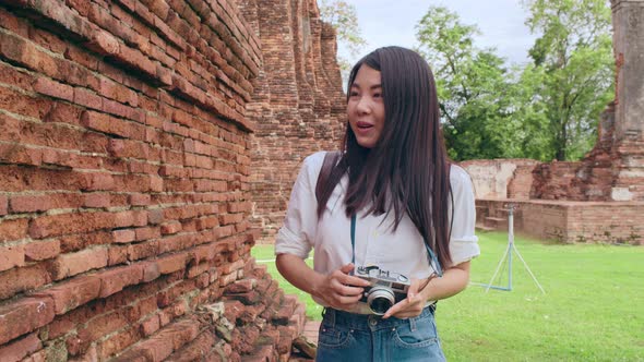 Japanese backpacker female enjoy her journey at amazing landmark in traditional city.