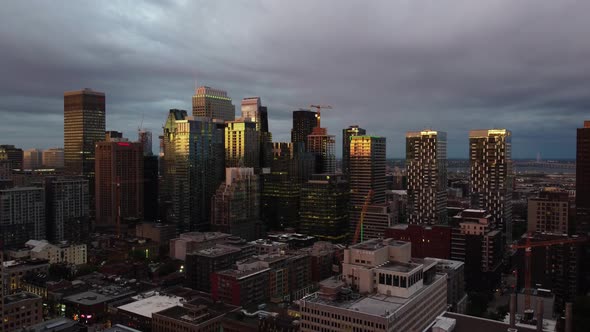 An aerial shot of city of downtown Montreal, during evening, dolly out