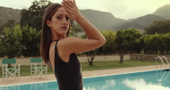 girl in a bathing suit near the pool