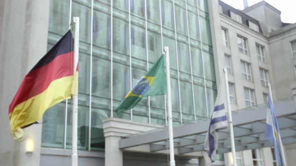 International flags wave in the breeze in front of a luxury hotel in Buenos Aires, Argentina