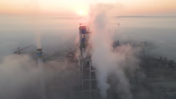 Aerial View of Cement Factory with High Concrete Plant Structure and Tower Crane at Industrial