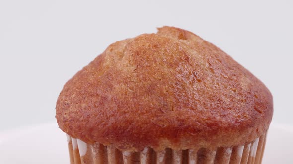 Muffins banana with white background shallow focus and slowly rotating.