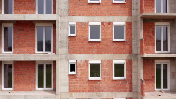 Apartment building under construction: outer wall made of bricks