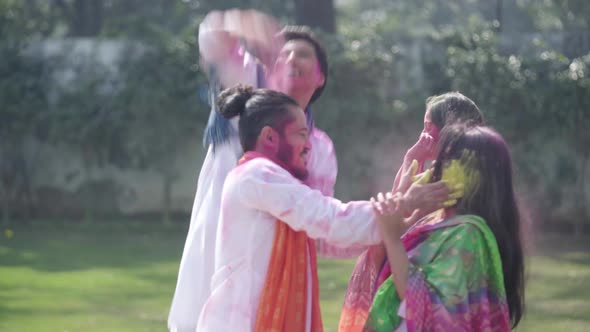 Indian couples playing Holi